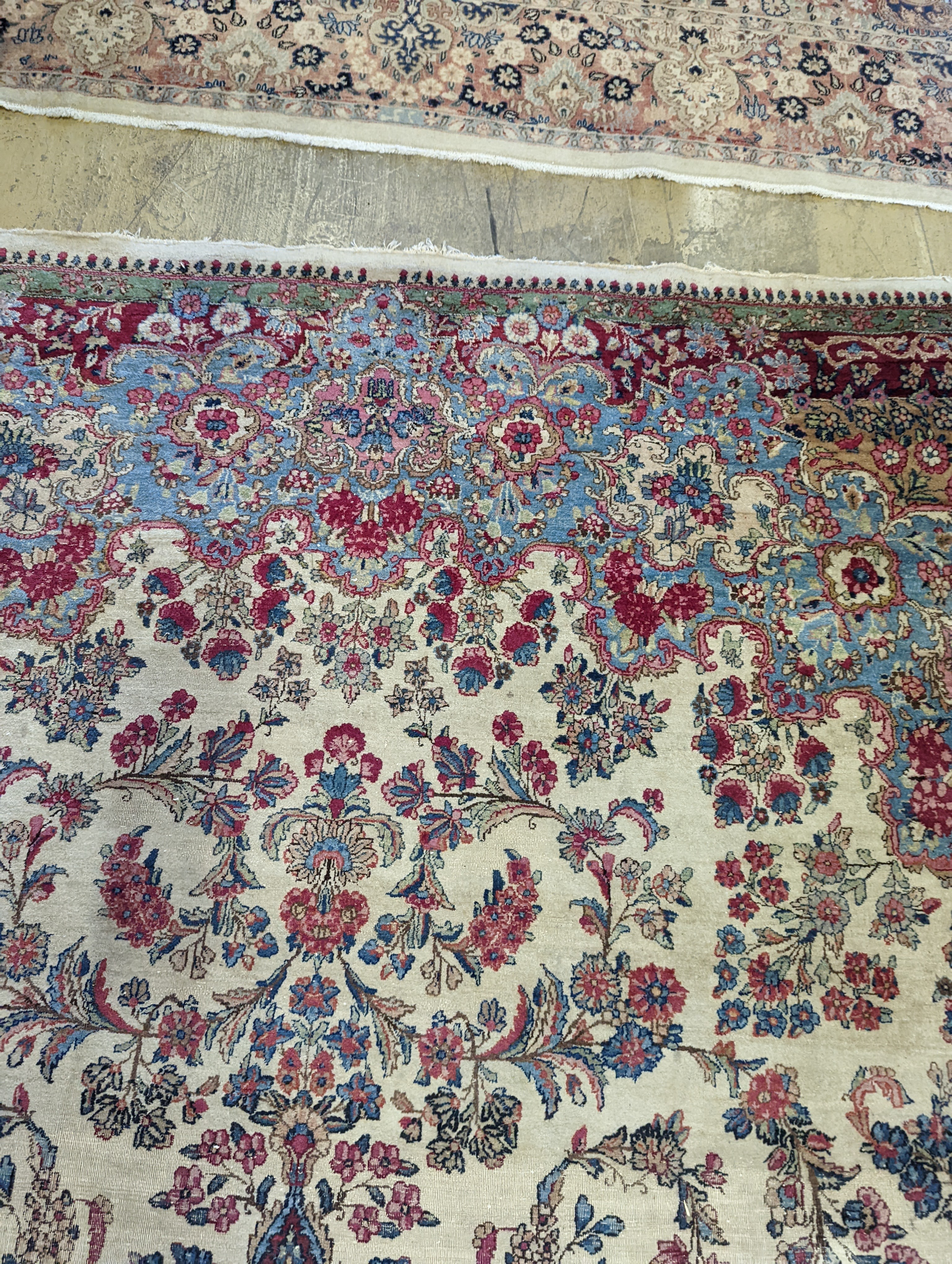 A North West Persian ivory ground carpet, 396 x 290cm